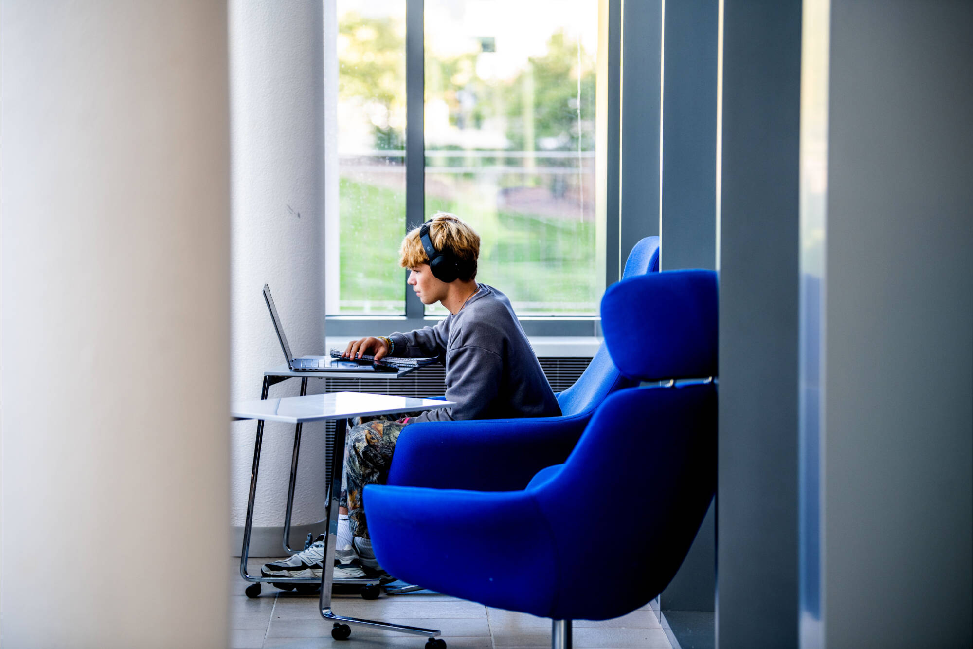 First-year student Evan Therkildsen works on his laptop